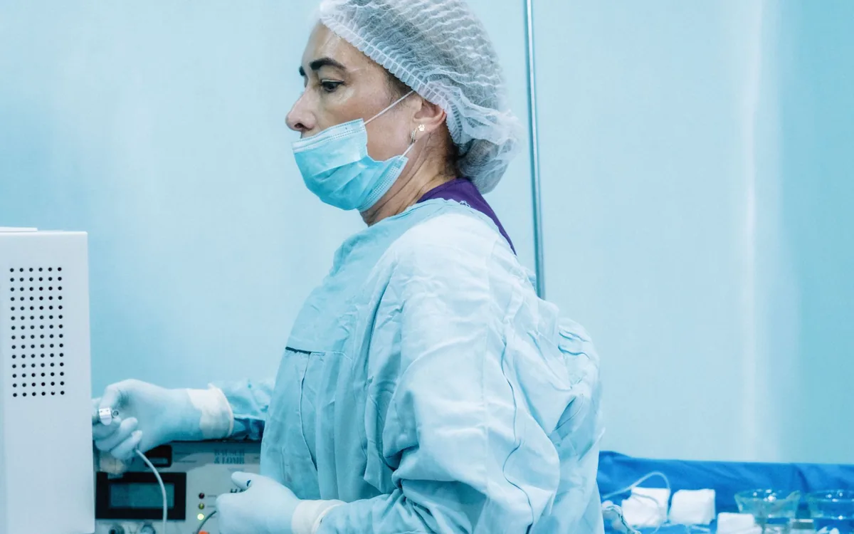 Theatre nurse preparing sterile equipment before an operation